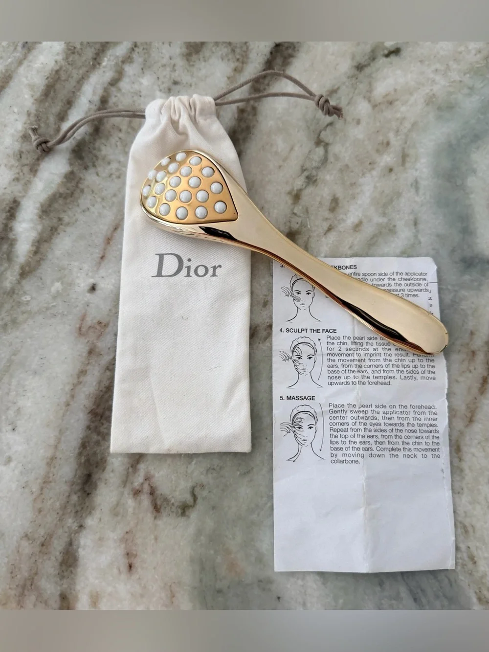 Dior Prestige Le Pétale Multi-Perlé Massage Tool with a branded protective pouch